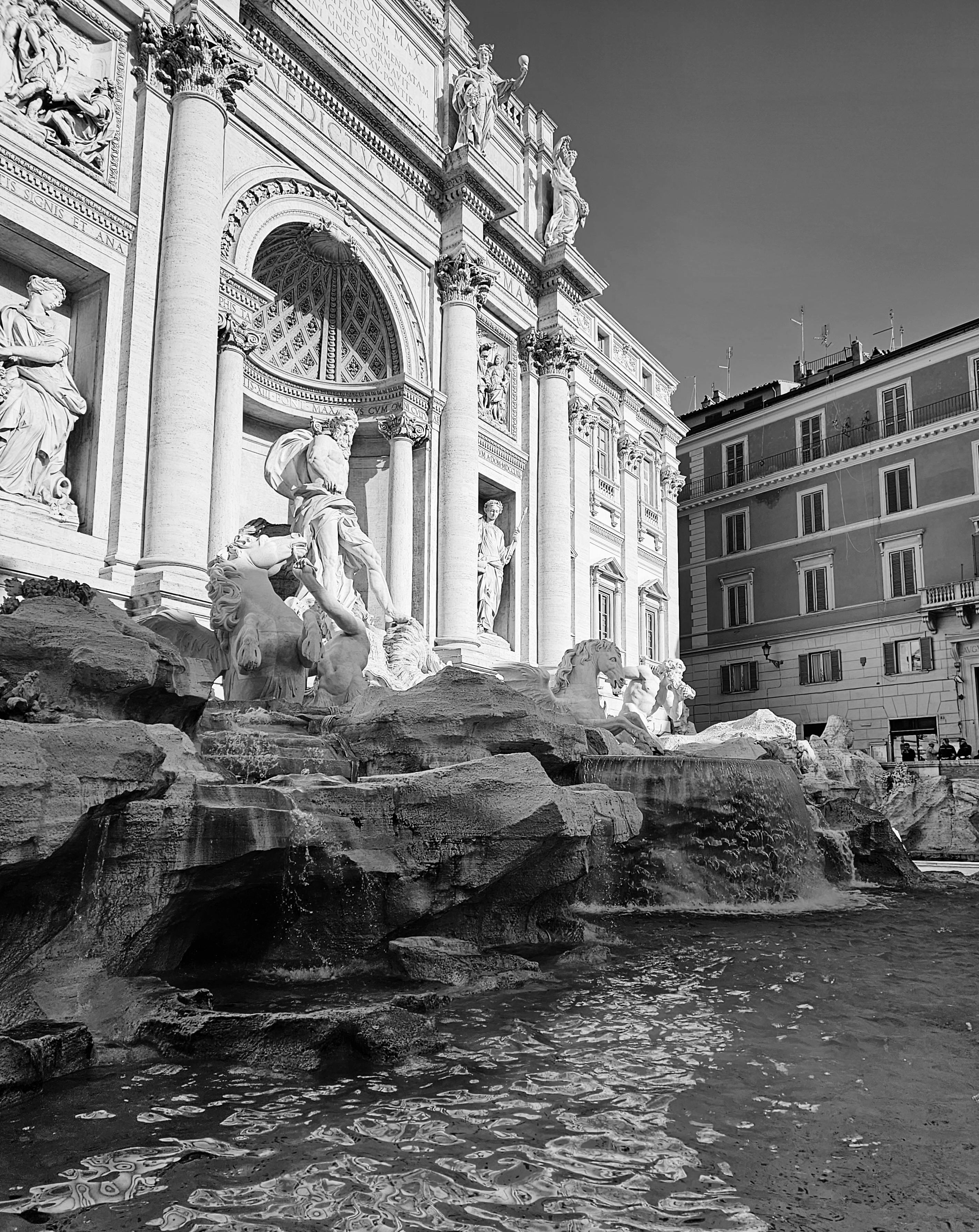 A stunning black and white photo of the Trevi Fountain, Rome's iconic landmark.
