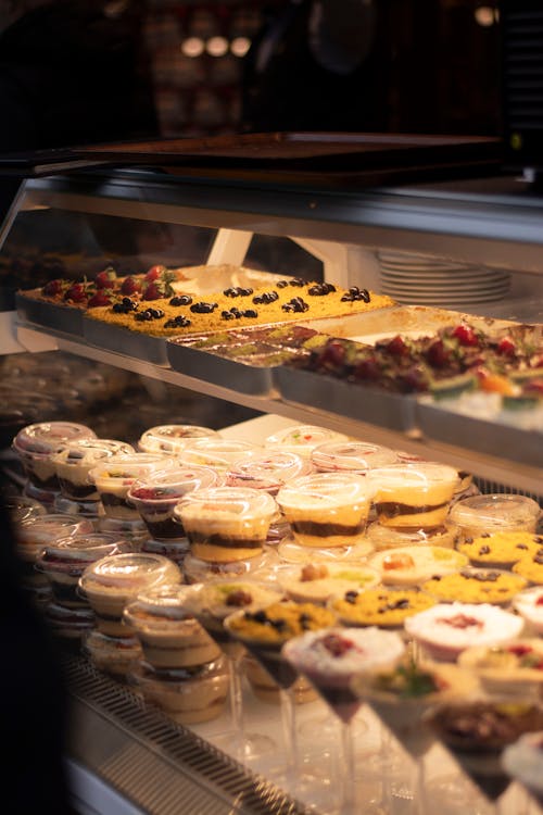 Delicious Desserts in the Refrigerator of a Confectionery Shop