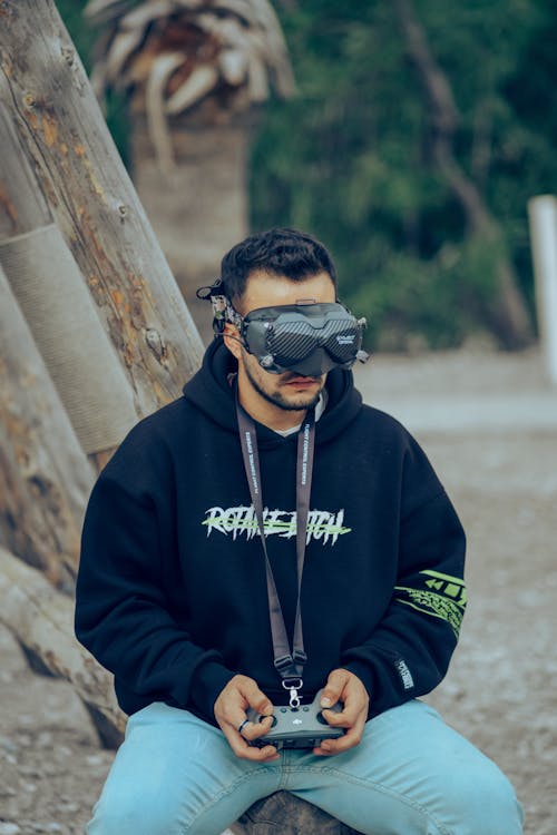 Man Sitting in Virtual Reality Goggles