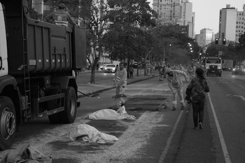 Men Fixing the Street in City 