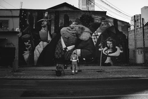 Cleaner near Mural on Wall