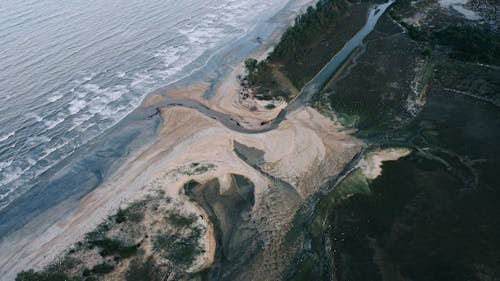 Aerial View of Waves Washing up the Beach 
