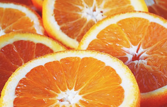Vivid close-up of freshly sliced oranges showcasing vibrant colors and freshness.