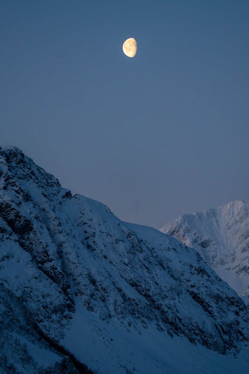 Moon Above Mountain Valley in Winter 