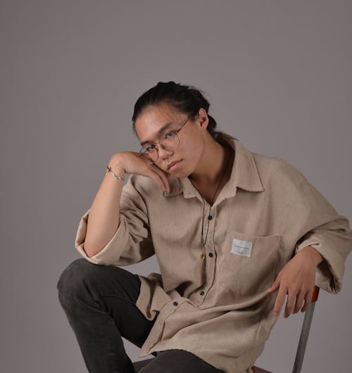 Young Woman Sitting on a Chair 