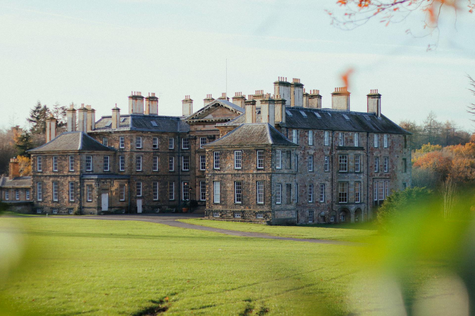 Dalkeith Palace in Midlothian, Scotland, showcasing medieval architecture and lush gardens.