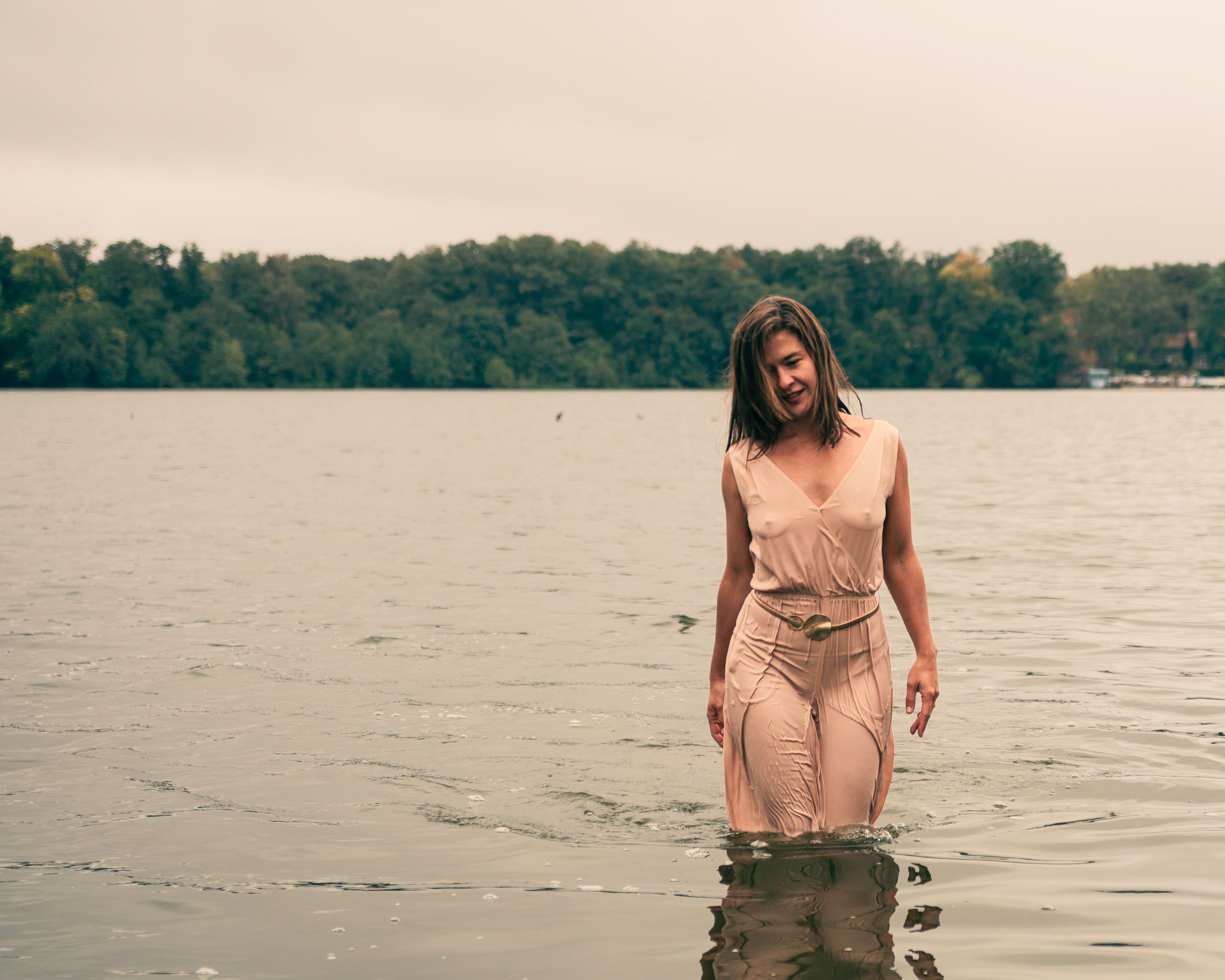 Woman in a Wet Dress Standing in a Lake  Free Stock Photo