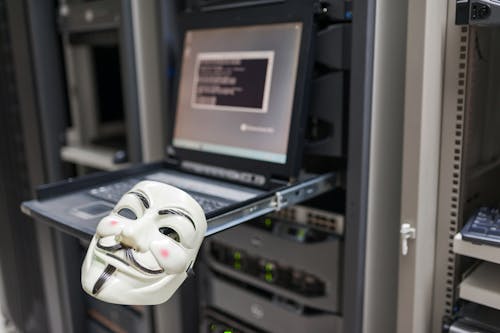 Hacker mask in data center room