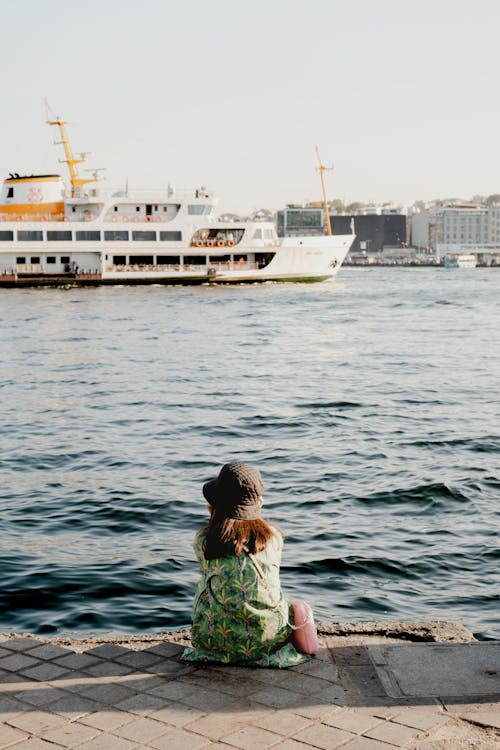 Girl Sitting on Sea Shore in Istanbul