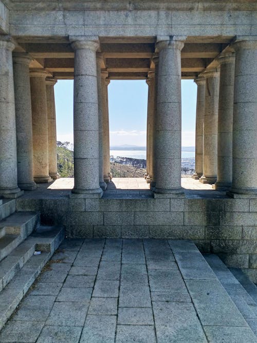 A sea view through the monument columns