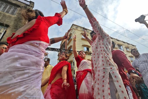 People Dancing in the Street at a Hindu Festival