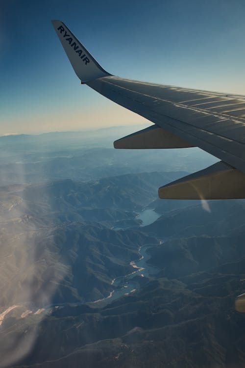 Free stock photo of aeroplane, airplane window, blue mountains