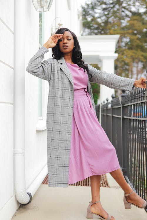 Woman Standing And Holding On Railing