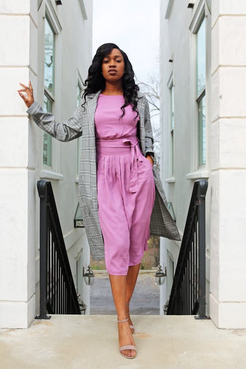 Woman In Pink Rompers And Grey Coat