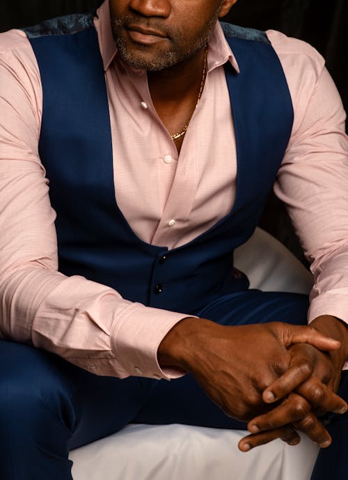 Model in a Pink Shirt Blue Waistcoat and Suit Pants