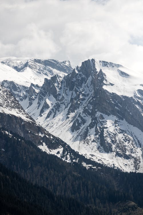 A mountain range with snow covered peaks