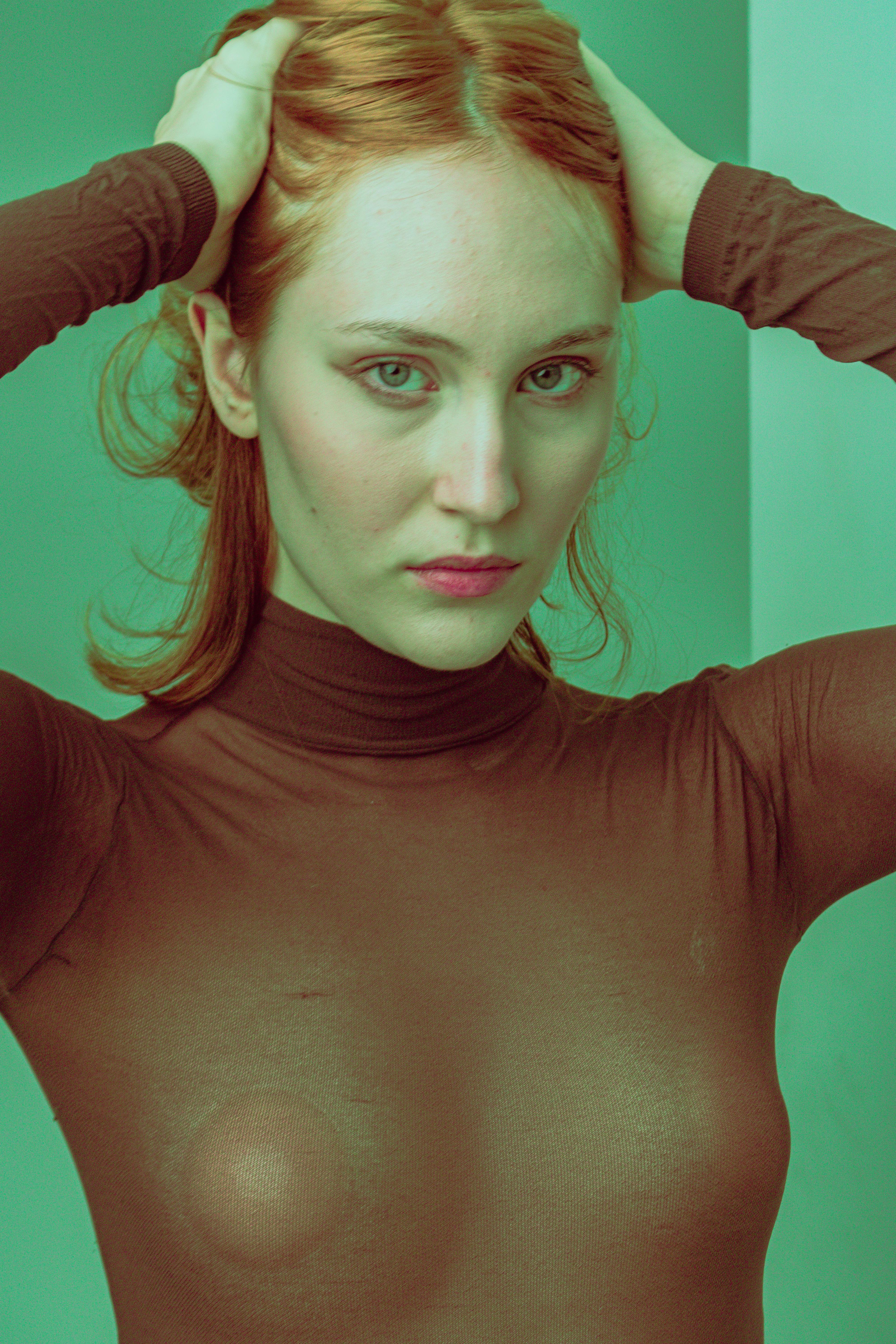 Redhead Model Wearing Silicone Nipple Covers to See Through Turtleneck ·  Free Stock Photo