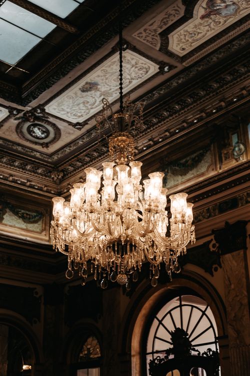 Free A luxurious chandelier illuminates an ornate historic room in Belo Horizonte, Brazil. Stock Photo