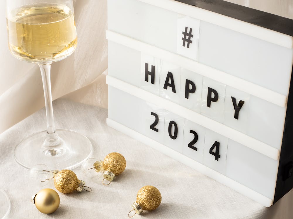 happy new year 2024 message on a table