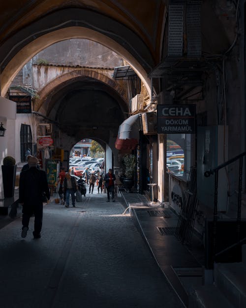 People in Alley with Stores in Town in Turkey