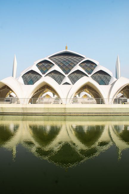 Stunning architecture of Al Jabbar Grand Mosque reflected in water, Bandung, Indonesia.