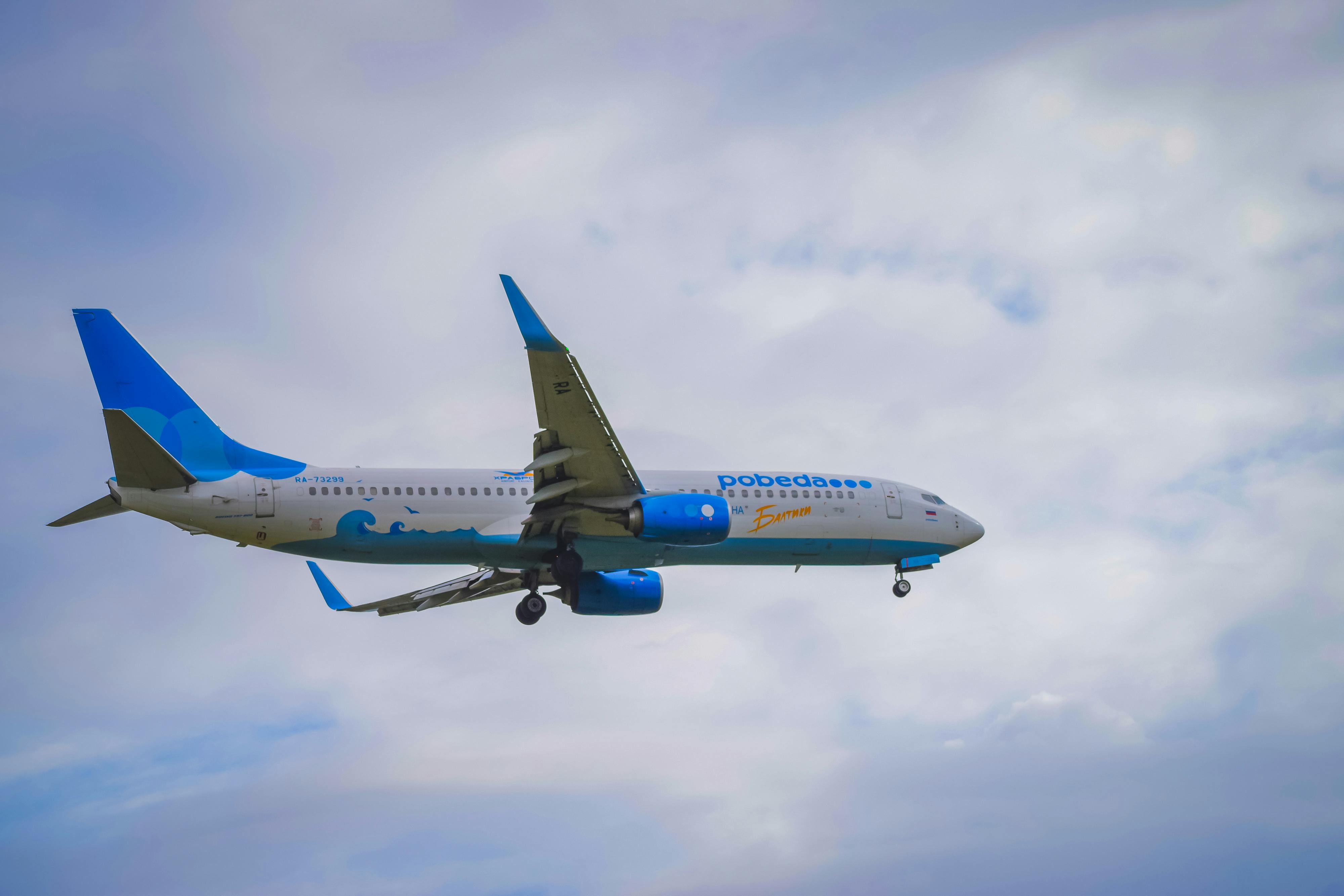 Commercial Airplane Flying against the Clouds · Free Stock Photo