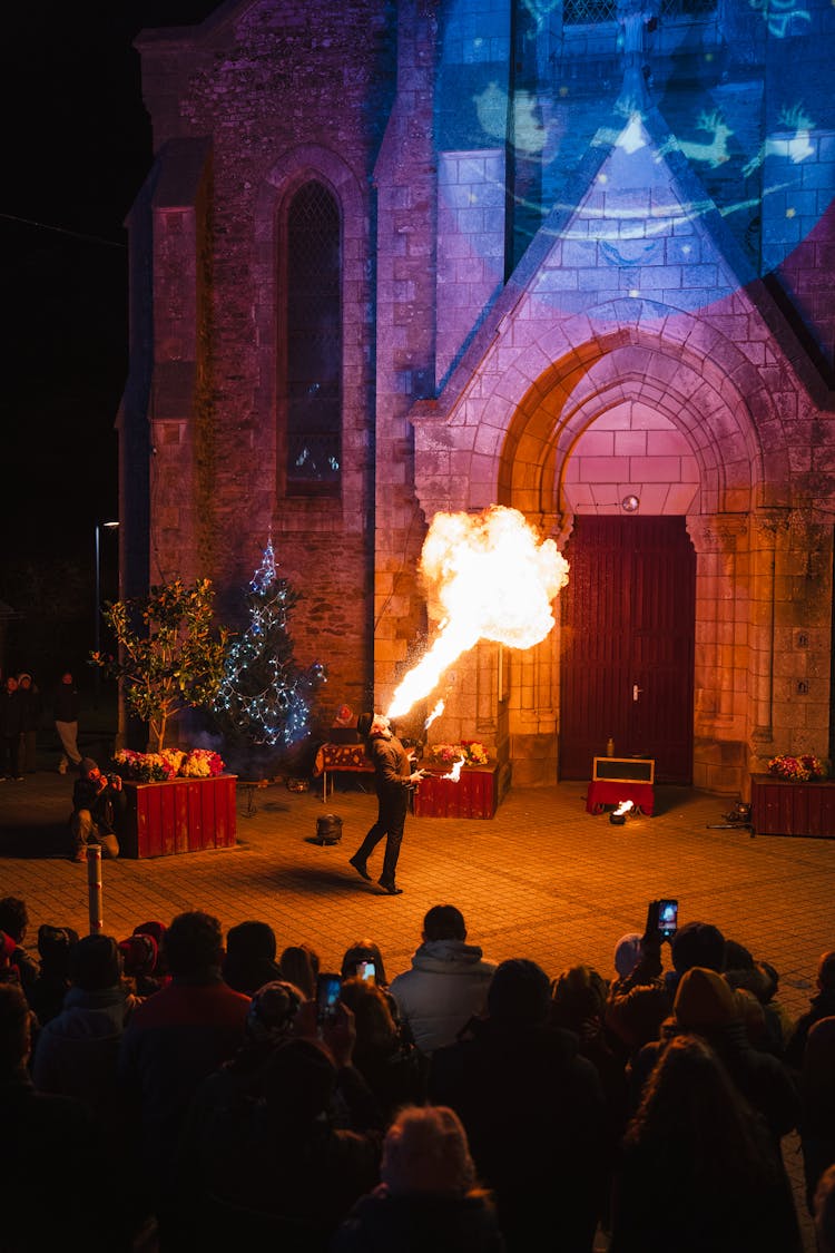 Man Dancing With Fire In Front Of The Audience 