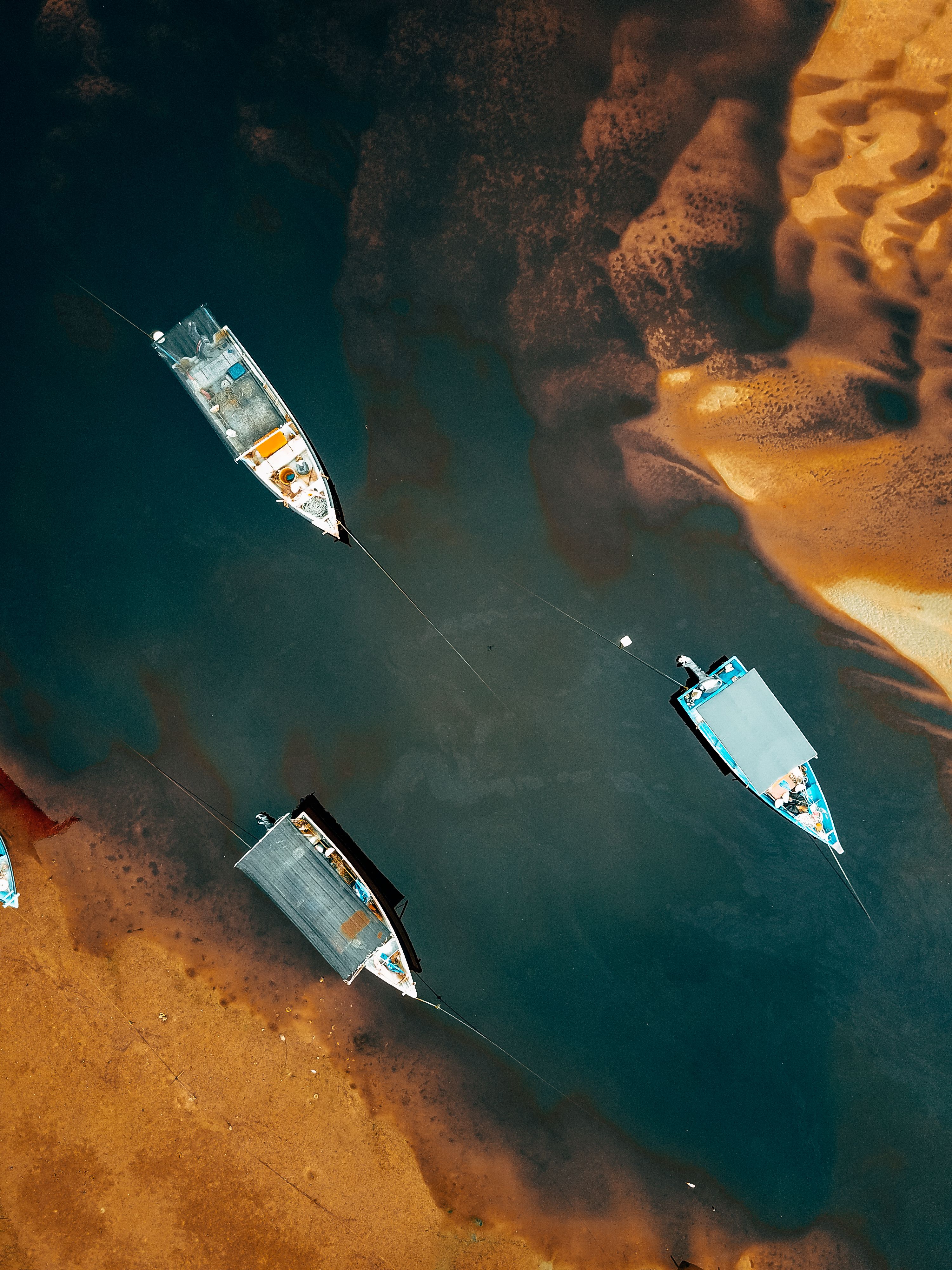 Aerial View of Fishing Boats by a Sandy Shore · Free Stock Photo