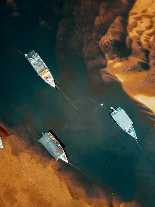 Aerial View of Fishing Boats by a Sandy Shore