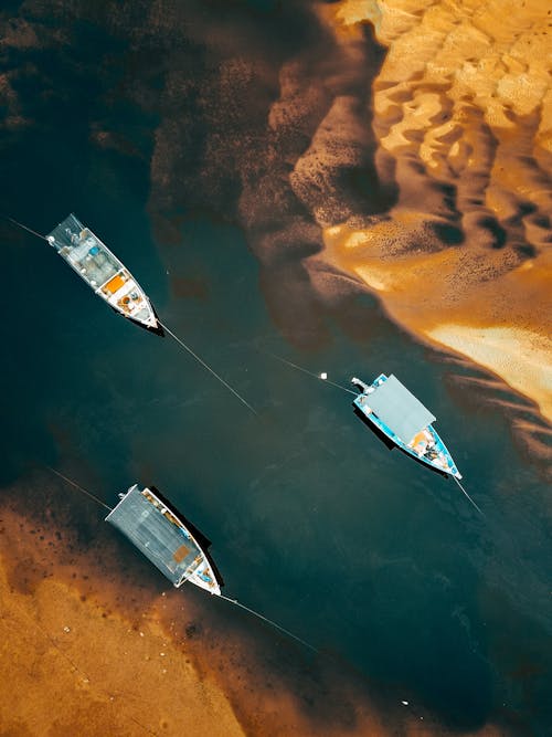 Aerial View of Fishing Boats by a Sandy Shore