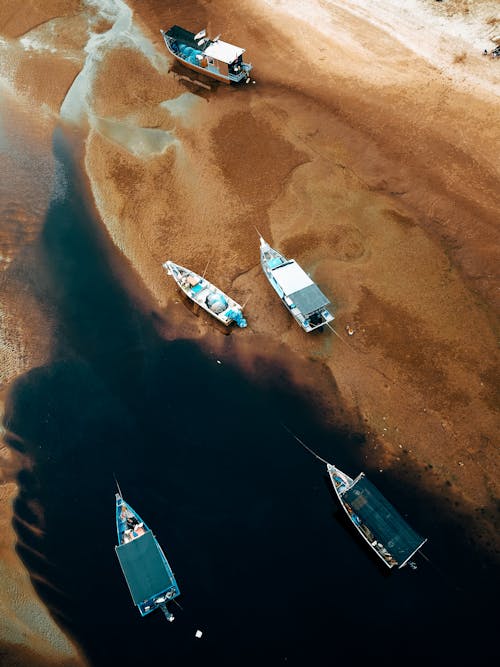 Aerial View of Boats Moored on the Shore 