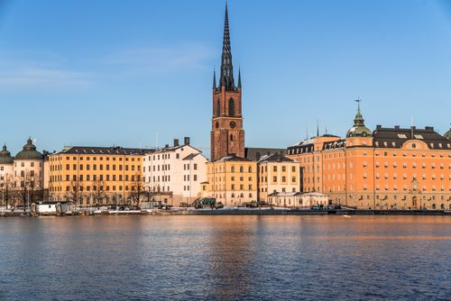 Free Explore the historic waterfront of Stockholm with its stunning architecture and serene waterscape. Stock Photo