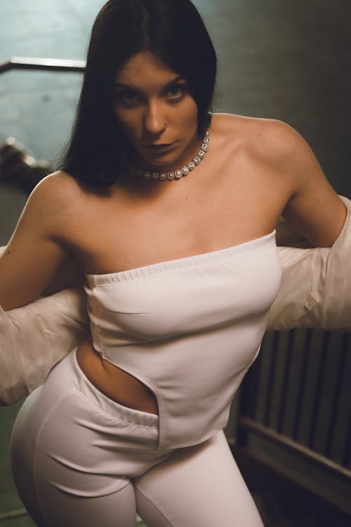 Young Woman Posing in a Trendy White Outfit 