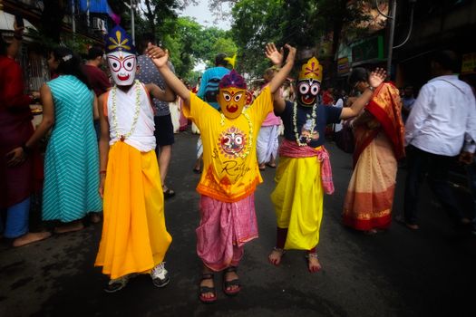 Children in traditional costumes celebrating Rath Yatra in Kolkata.
