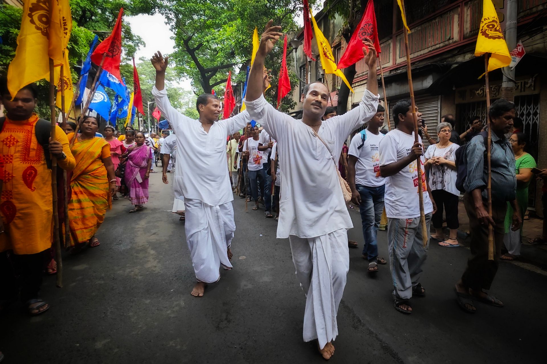 Joyful celebration of the Rath Yatra festival in Kolkata showcasing cultural traditions and vibrant colors.