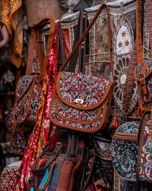 Handmade Bags in Traditional Patterns Hanging on a Market Stall 