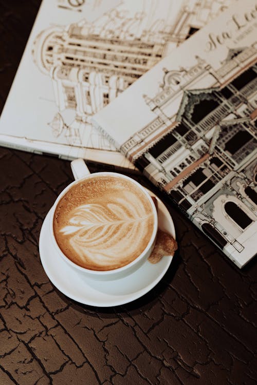 Free A Cup of Coffee and a Cookie on the Table  Stock Photo