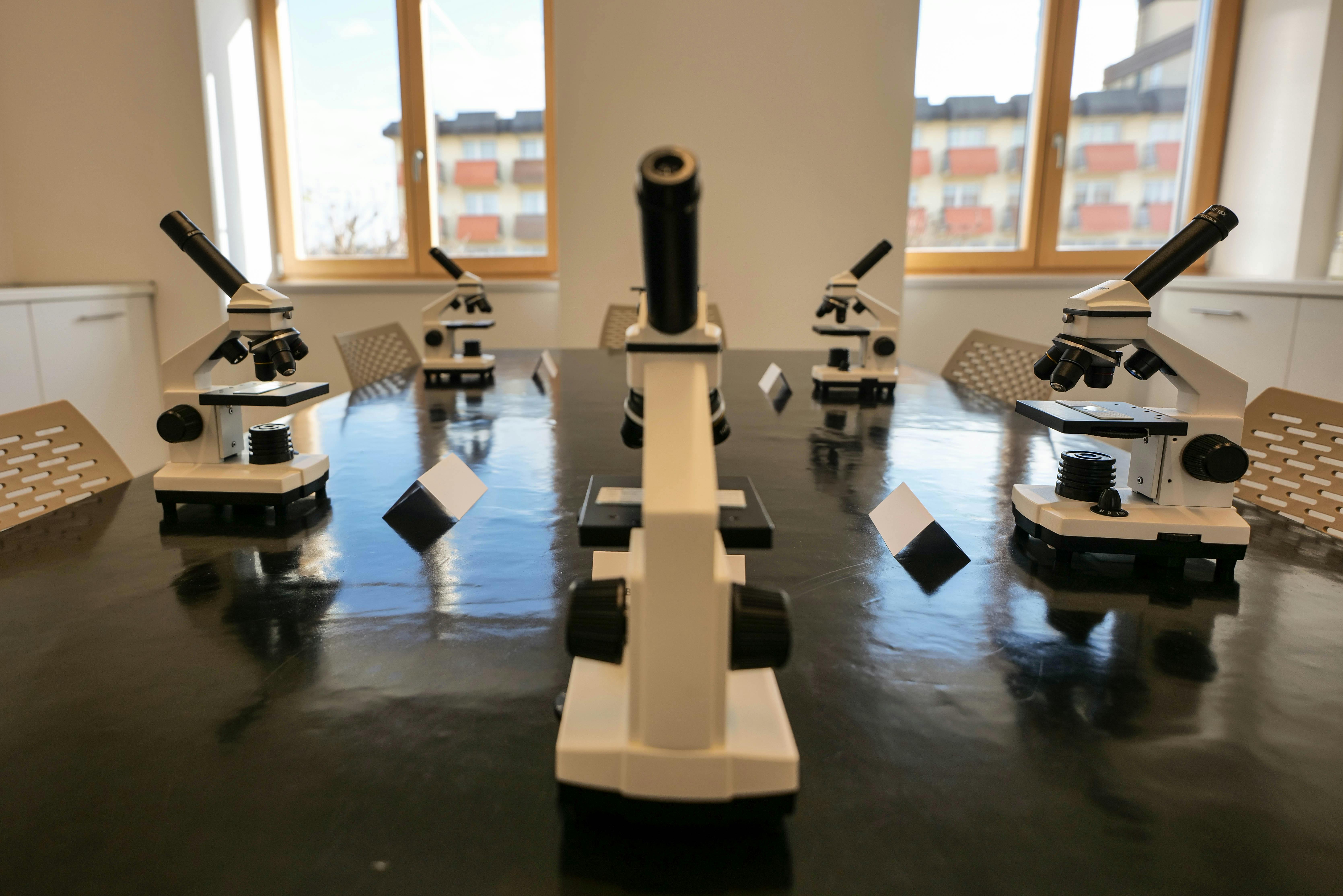 Semiconductor wafer inspected under a microscope in a clean room