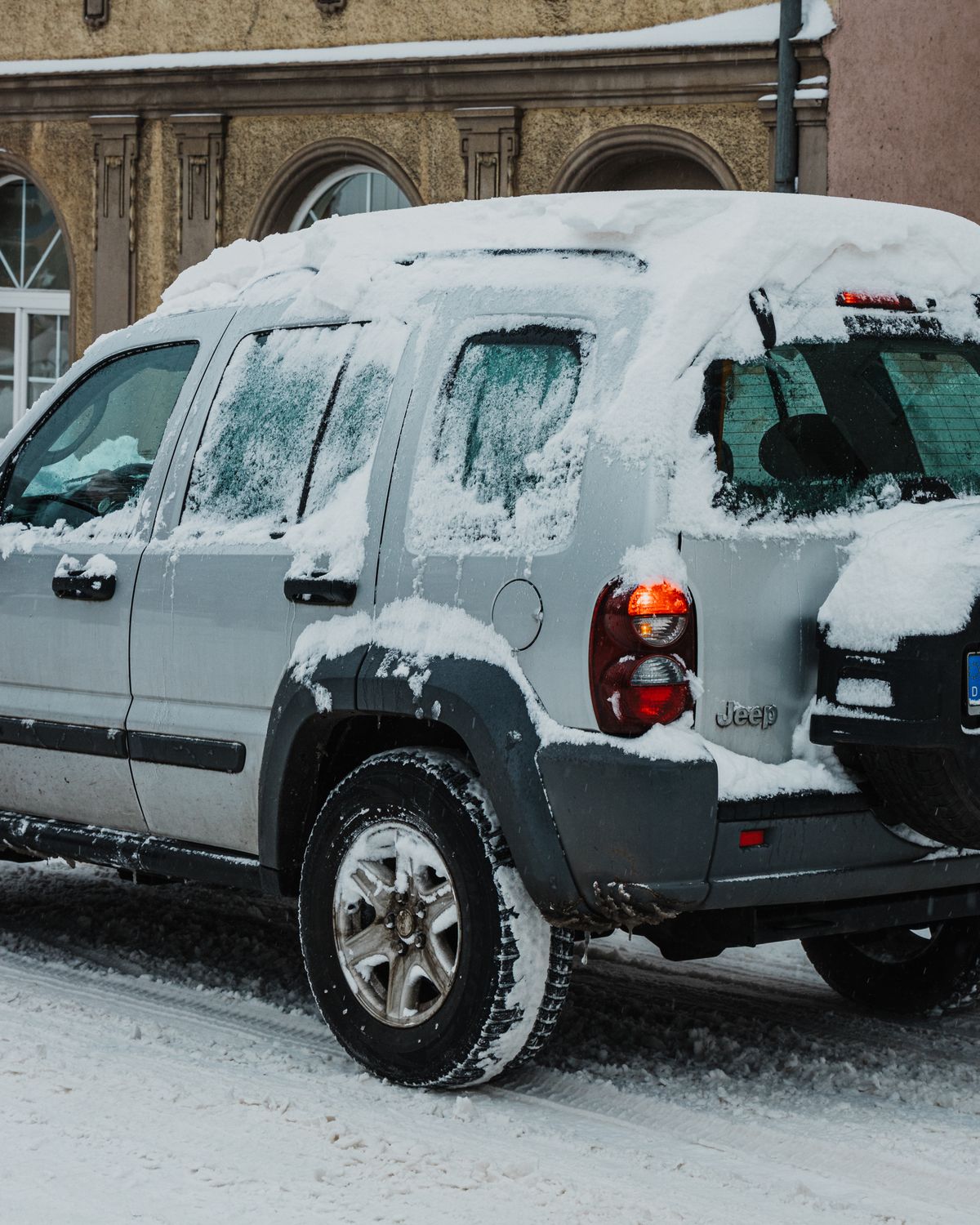 A Car on the Street Covered in Snow · Free Stock Photo