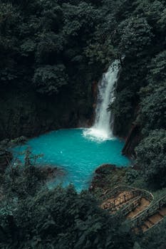 Discover the breathtaking waterfall at Rio Celeste, Costa Rica. Perfect for travel and nature lovers.