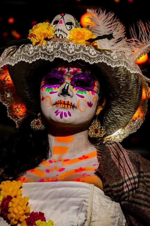 Free Detailed portrait of a woman in vibrant Day of the Dead costume with traditional makeup. Stock Photo
