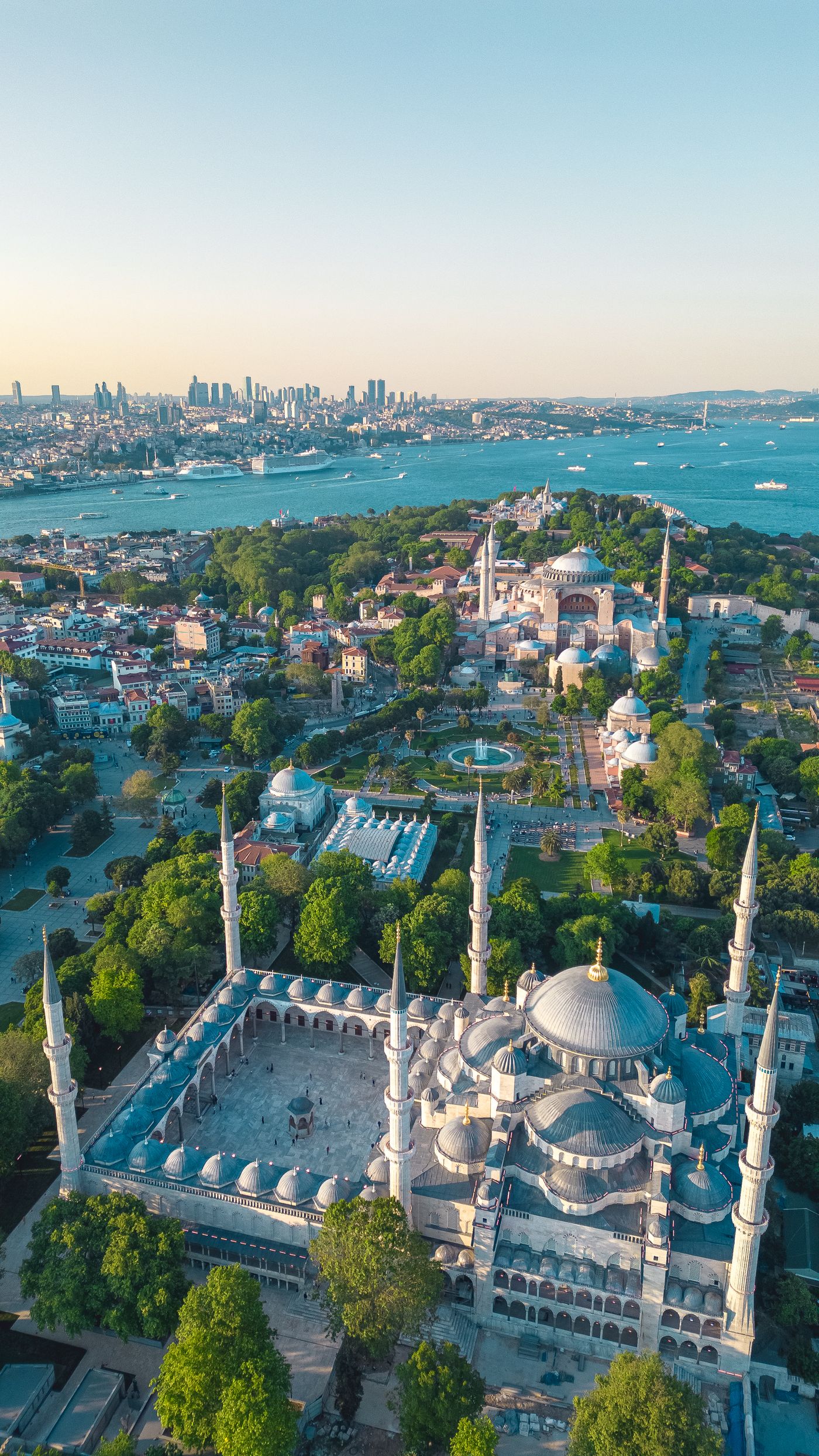 Aerial view of the Blue Mosque in Istanbul with its domes and minarets, the city and the Bosphorus behind
