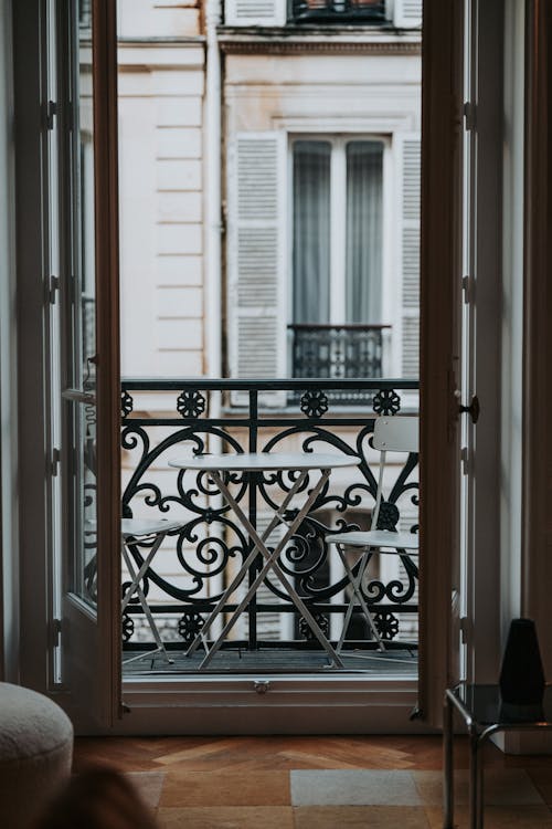 Table and Chairs on the Balcony of a Paris Apartment
