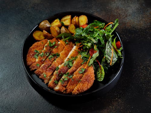 Schnitzel with Baked Potatoes and Arugula Salad