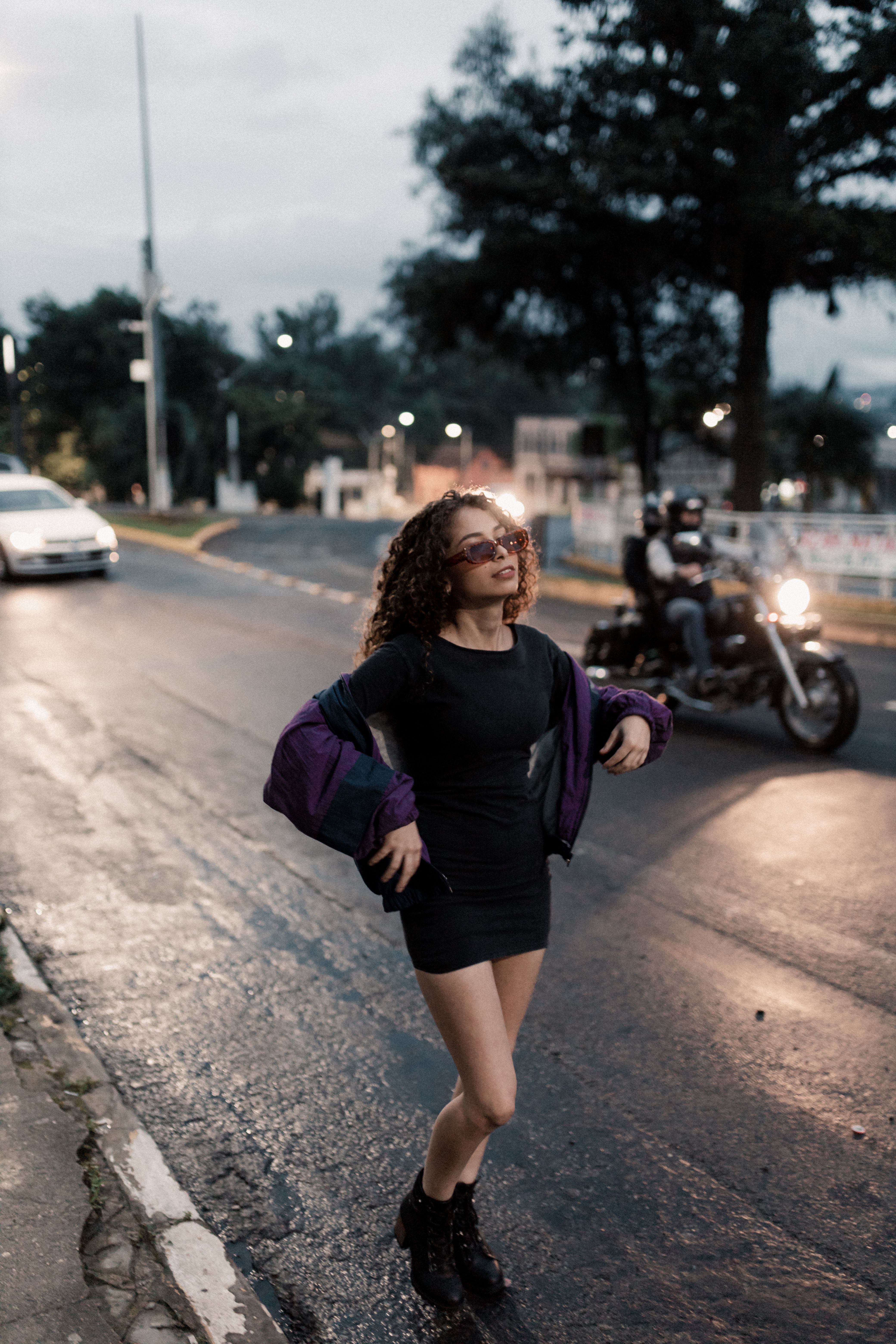 Brunette Woman in Black Dress Walking on Road · Free Stock Photo