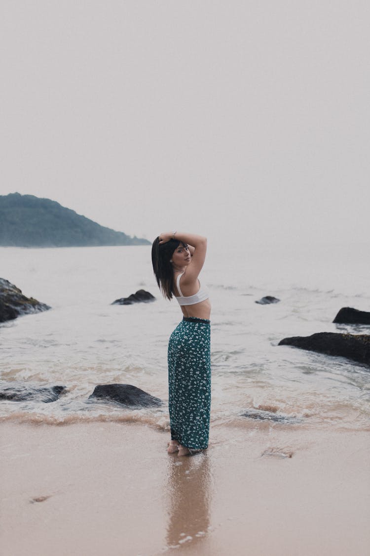 Brunette Woman Posing On A Beach 