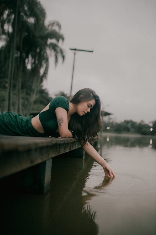 Woman by the River on Tropical Beach 