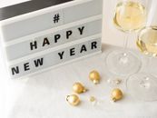 Celebrate the New Year with champagne and festive decorations. Perfect for holiday cheer.