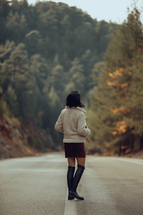 Woman in an Elegant Autumnal Outfit Posing Outside 