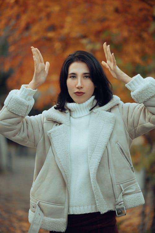 Young Elegant Woman in an Autumnal Outfit Standing Outside 